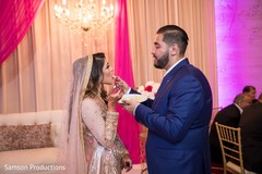 Indian groom feeding his Maharani some cake Indian groom feeding his Maharani some cake