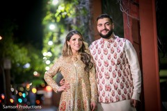 Indian bride and her Indian groom with a street in the background Indian bride and her Indian groom with a street in the background
