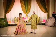 Indian couple holding hands in front of the stage Indian couple holding hands in front of the stage
