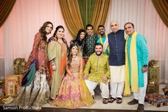 Indian couple surrounded by their Indian relatives on stage Indian couple surrounded by their Indian relatives on stage