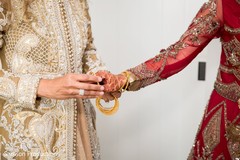 Indian relative putting bracelets on the Indian bride Indian relative putting bracelets on the Indian bride
