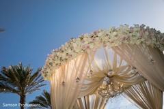 The decorated top of the wedding stage with the blue sky as background The decorated top of the wedding stage with the blue sky as background
