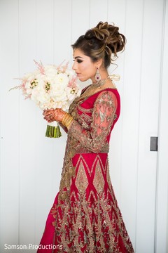 Indian bride posing with her wedding bouquet Indian bride posing with her wedding bouquet