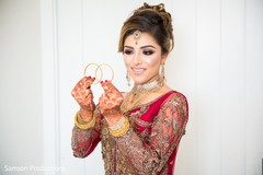 Maharani holding two golden rings together Maharani holding two golden rings together