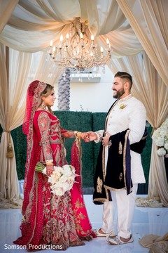 Indian groom holding his Maharani's hand Indian groom holding his Maharani's hand