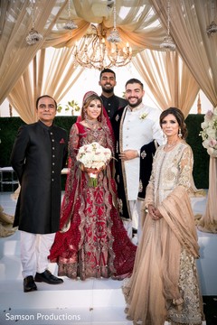 Indian newlyweds and Indian relatives on the wedding stage Indian newlyweds and Indian relatives on the wedding stage