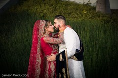 Indian newlyweds kiss outside the venue Indian newlyweds kiss outside the venue