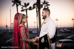 Indian newlywed couple sharing a moment at sunset Indian newlywed couple sharing a moment at sunset
