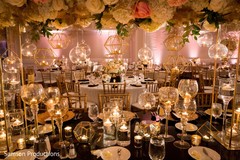 The hall decorated with flowers and other golden items The hall decorated with flowers and other golden items