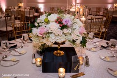A small flower arrangement in the center of one of the tables A small flower arrangement in the center of one of the tables