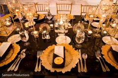 Golden tableware on the reception tables Golden tableware on the reception tables