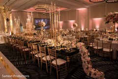 A table decorated with a long flower arrangement A table decorated with a long flower arrangement