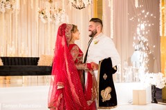 Indian newlywed couple laughing together Indian newlywed couple laughing together