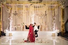 Indian newlywed couple sharing a moment at the reception hall Indian newlywed couple sharing a moment at the reception hall