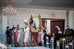 Indian bride entry in a gold and white palki. Indian bride entry in a gold and white palki.