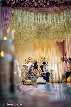 The sacred fire being lit by the bride and groom. The sacred fire being lit by the bride and groom.