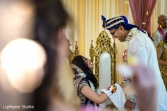 Indian bride and groom laughing during their wedding ceremony. Indian bride and groom laughing during their wedding ceremony.