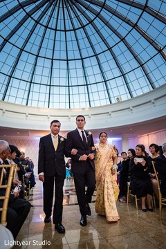 Indian groom wearing a black suit. Indian groom wearing a black suit.