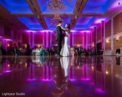 Indian fusion couple dancing at their wedding reception party. Indian fusion couple dancing at their wedding reception party.