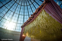Cream color flowers hanging from the mandap. Cream color flowers hanging from the mandap.