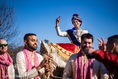 Indian groom riding on his white baraat horse Indian groom riding on his white baraat horse