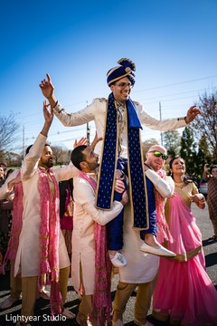 Indian groom being lifted by groomsmen at baraat. Indian groom being lifted by groomsmen at baraat.