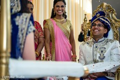 Indian groom being uncovered from antarpat. Indian groom being uncovered from antarpat.
