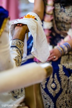 Indian couple's hands being covered ritual. Indian couple's hands being covered ritual.