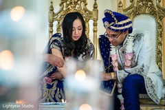 Indian couple pouring offerings to sacred fire. Indian couple pouring offerings to sacred fire.