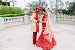 Indian couple in wedding attires posing for photo. Indian couple in wedding attires posing for photo.
