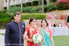 Maharani walking through the wedding aisle with relatives. Maharani walking through the wedding aisle with relatives.
