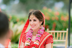 Indian bride smiling during their hindu wedding ceremony. Indian bride smiling during their hindu wedding ceremony.