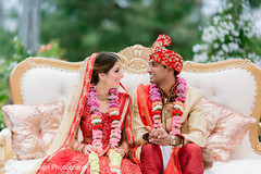 Indian couple sitting on the altar's couch. Indian couple sitting on the altar's couch.