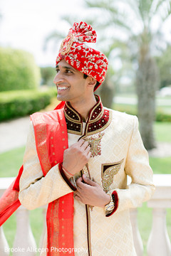 Indian groom adjusting his sherwani. Indian groom adjusting his sherwani.