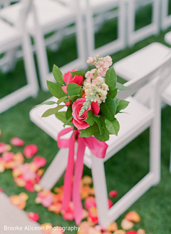 Flowers decorating wedding chairs. Flowers decorating wedding chairs.
