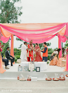 Indian couple with the priest and the bestman during ceremony. Indian couple with the priest and the bestman during ceremony.