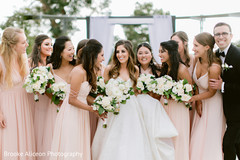 Maharani and her bridesmaids holding bouquets. Maharani and her bridesmaids holding bouquets.
