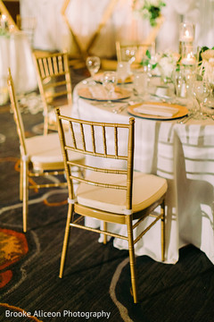 Golden chairs used in the reception party. Golden chairs used in the reception party.