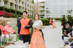 Bridesmaids and groomsmen walking down the wedding aisle. Bridesmaids and groomsmen walking down the wedding aisle.