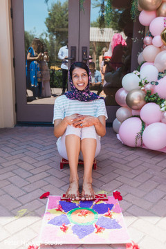 Maharani with her feet over a decorated rug. Maharani with her feet over a decorated rug.