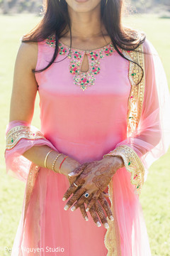 Indian bride showing her henna art and her engagement ring. Indian bride showing her henna art and her engagement ring.