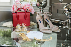 Indian bridal ceremony jewelry, shoes and red hand bag. Indian bridal ceremony jewelry, shoes and red hand bag.