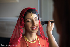 Maharani getting her ceremony makeup done. Maharani getting her ceremony makeup done.
