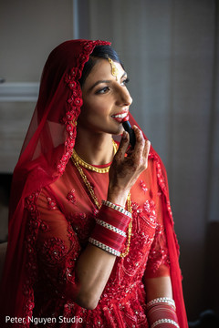 Maharani putting her red lipstick on. Maharani putting her red lipstick on.