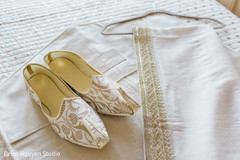 White and golden Indian groom's shoes and veil. White and golden Indian groom's shoes and veil.