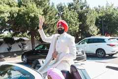 Indian groom waiving from his vehicle. Indian groom waiving from his vehicle.