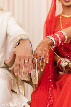 Indian couple showing their wedding rings capture. Indian couple showing their wedding rings capture.