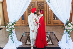 Indian bride and groom posing outdoors capture. Indian bride and groom posing outdoors capture.