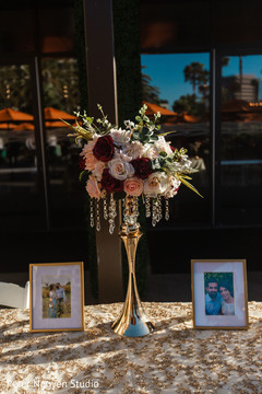 Colorful roses on indian wedding table tall flower base. Colorful roses on indian wedding table tall flower base.
