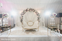 White with pink and red roses Indian wedding reception stage decor. White with pink and red roses Indian wedding reception stage decor.